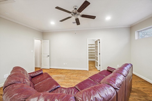 living room featuring crown molding, ceiling fan, and wood-type flooring