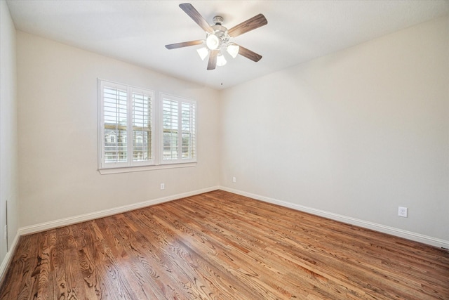 spare room with light hardwood / wood-style flooring and ceiling fan