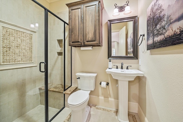 bathroom with tile patterned flooring, toilet, and an enclosed shower