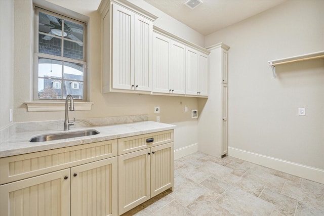 laundry area featuring cabinets, washer hookup, hookup for an electric dryer, and sink