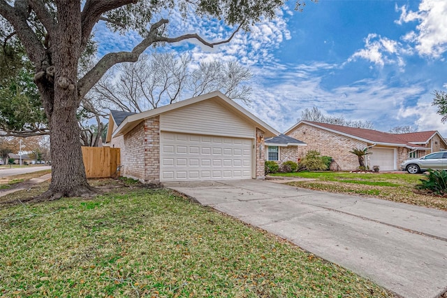 ranch-style home with a garage and a front yard