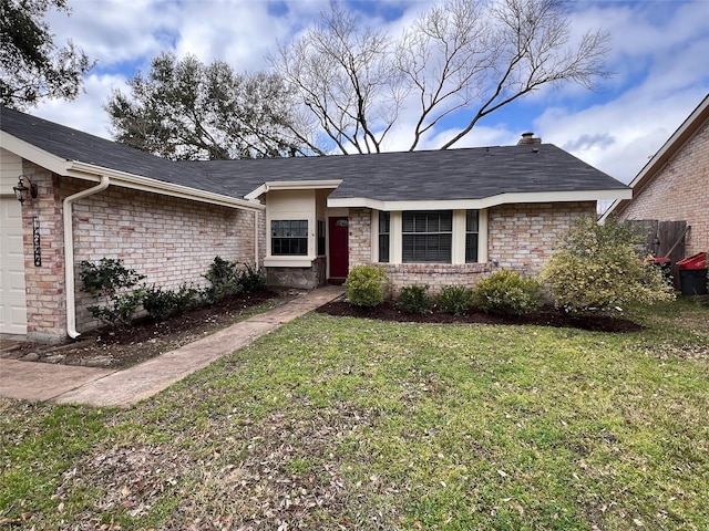 single story home featuring a garage and a front yard