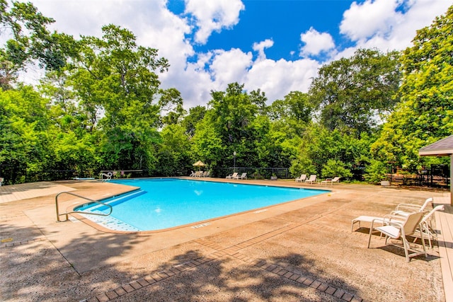 view of pool featuring a patio area