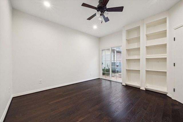 empty room featuring hardwood / wood-style floors, built in features, and ceiling fan