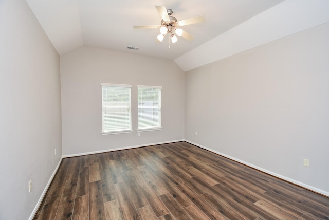 spare room featuring ceiling fan, dark hardwood / wood-style floors, and lofted ceiling