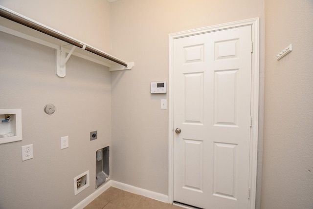 laundry area featuring light tile patterned flooring, washer hookup, and hookup for an electric dryer