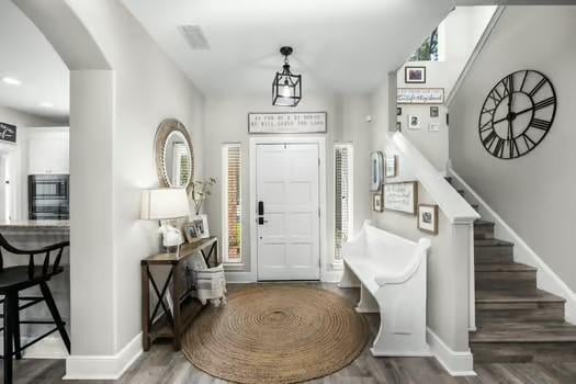 foyer entrance featuring dark hardwood / wood-style floors and plenty of natural light