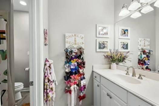 bathroom with vanity and toilet