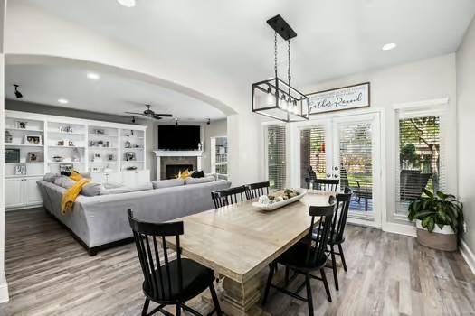 dining space featuring hardwood / wood-style flooring and ceiling fan