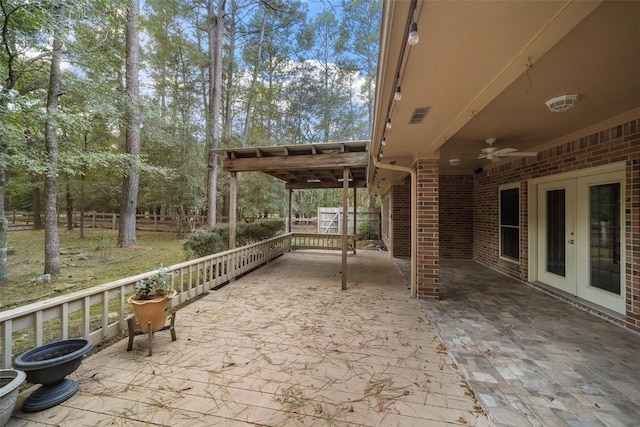 view of patio featuring french doors and ceiling fan