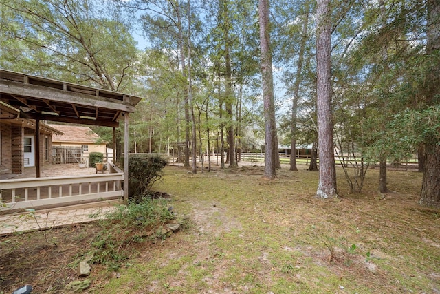 view of yard featuring a wooden deck