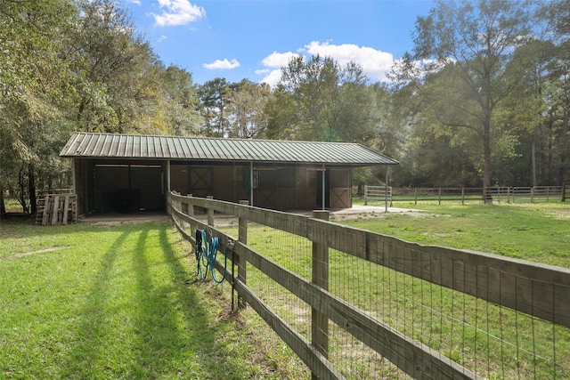 view of stable with a rural view