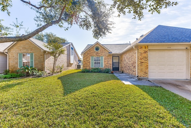 ranch-style home featuring central AC unit, a garage, and a front lawn