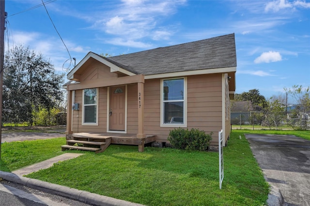 bungalow-style house with a front yard