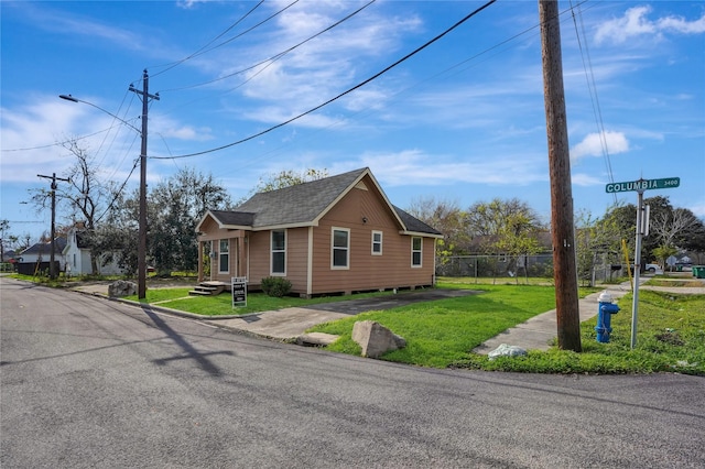 view of home's exterior with a yard