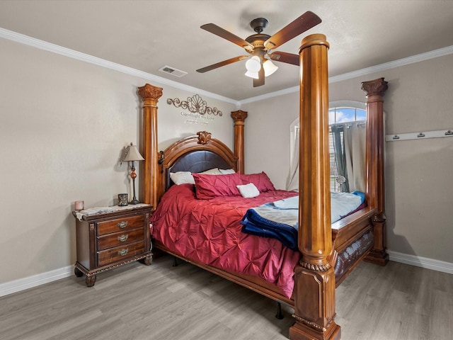 bedroom with ceiling fan, light hardwood / wood-style flooring, and ornamental molding