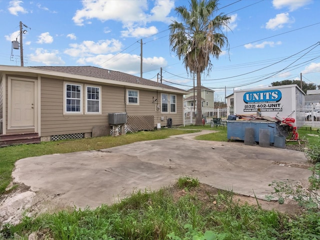 rear view of property featuring a patio area