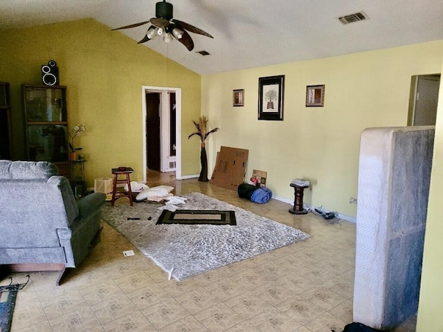 living room featuring ceiling fan and lofted ceiling