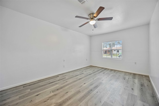 empty room with ceiling fan and light wood-type flooring