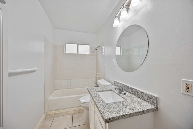 full bathroom featuring vanity, tile patterned flooring, tiled shower / bath, and toilet