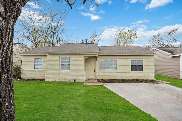 ranch-style home with a patio and a front lawn