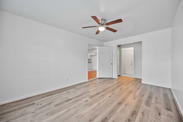 unfurnished bedroom with a closet, light hardwood / wood-style flooring, and ceiling fan