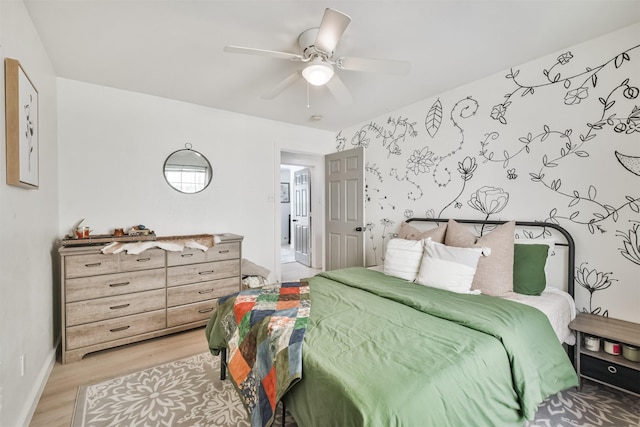 bedroom featuring ceiling fan and light hardwood / wood-style floors