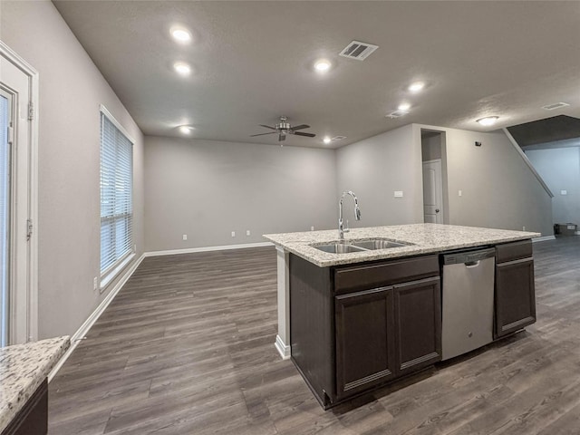 kitchen featuring dishwasher, dark hardwood / wood-style floors, sink, and a kitchen island with sink