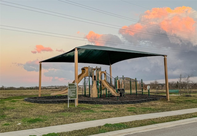 playground at dusk with a yard