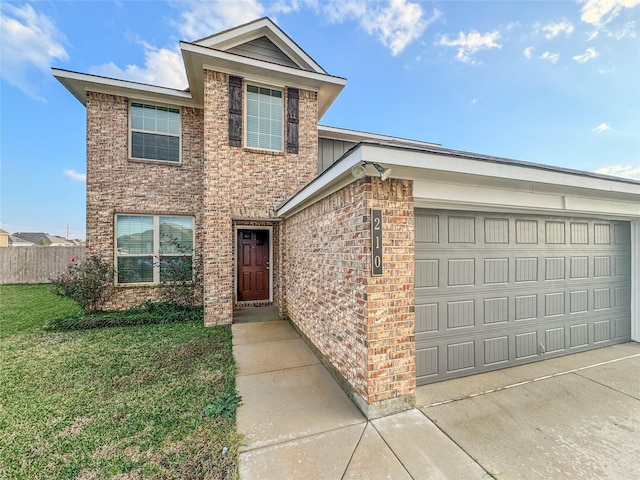 front of property featuring a front yard and a garage