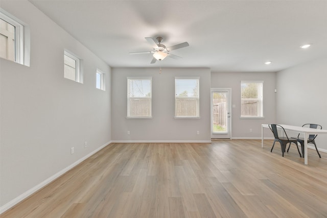 interior space with ceiling fan, light hardwood / wood-style floors, and a wealth of natural light