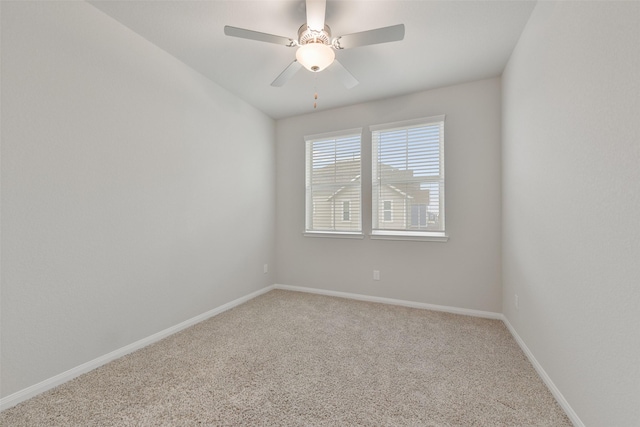 unfurnished room with carpet and ceiling fan