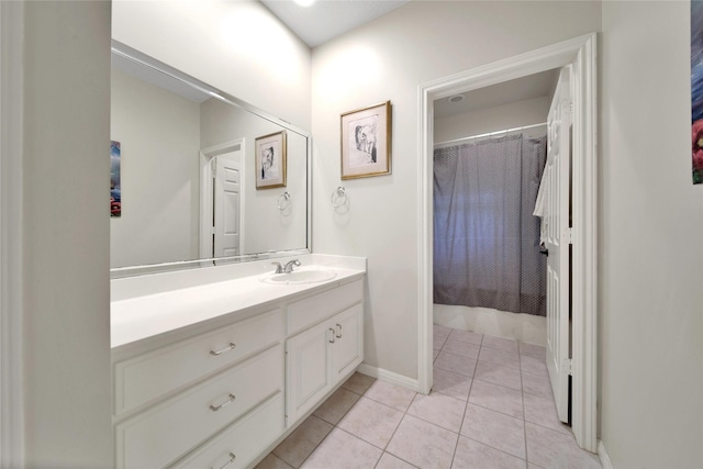 bathroom featuring tile patterned floors, vanity, and a shower with curtain