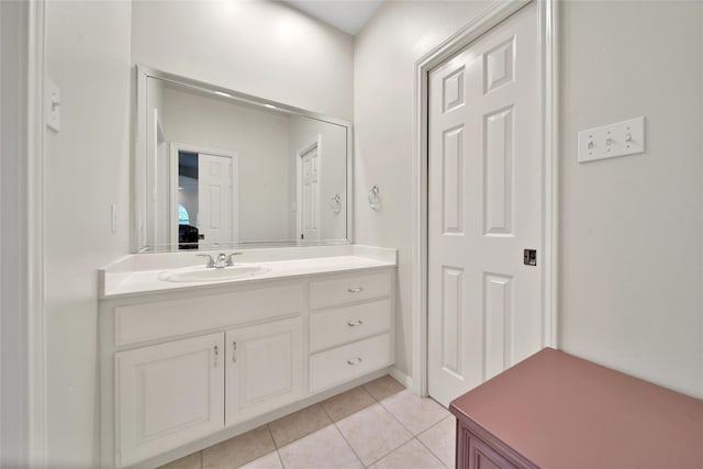 bathroom with tile patterned floors and vanity