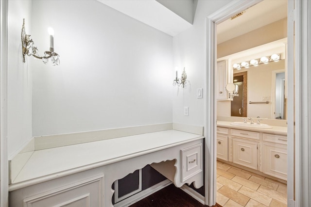 bathroom with tile patterned flooring and vanity