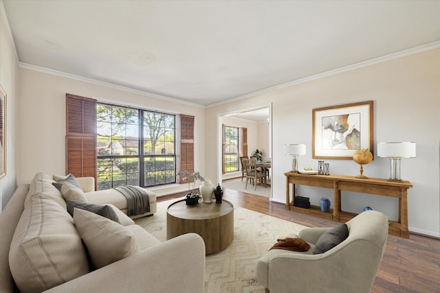 living room with hardwood / wood-style flooring and ornamental molding