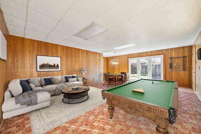 game room featuring wooden walls and pool table