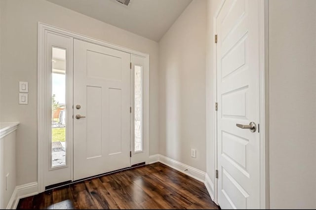 foyer entrance with dark hardwood / wood-style floors