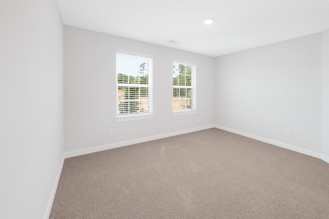 empty room featuring carpet flooring