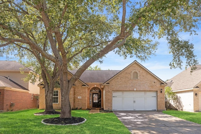 view of front of house with a front yard and a garage