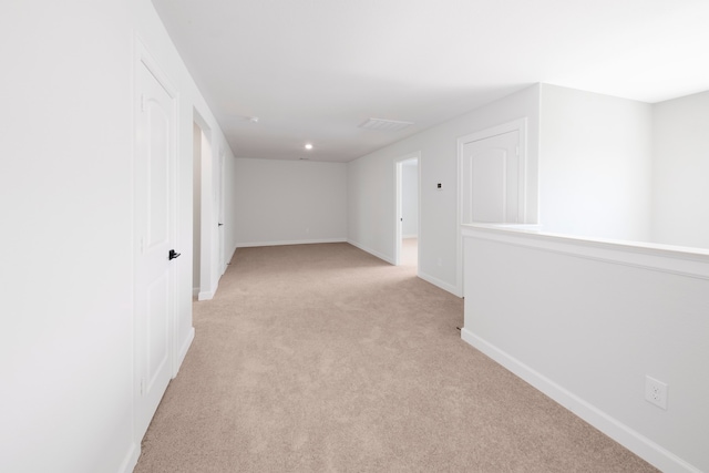 interior space featuring light colored carpet