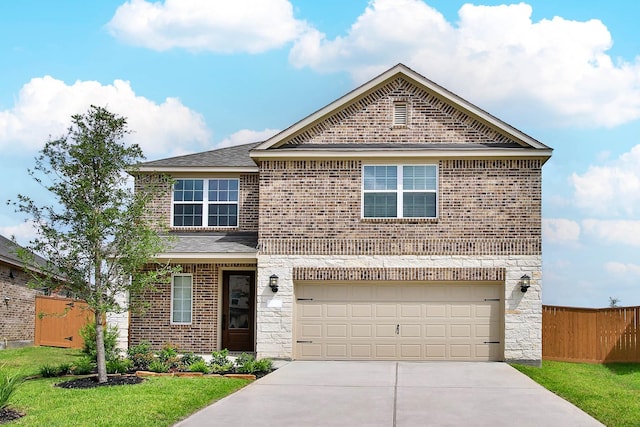 view of front property with a front yard and a garage