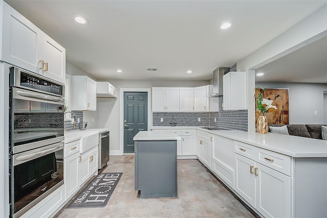 kitchen with white cabinets and appliances with stainless steel finishes