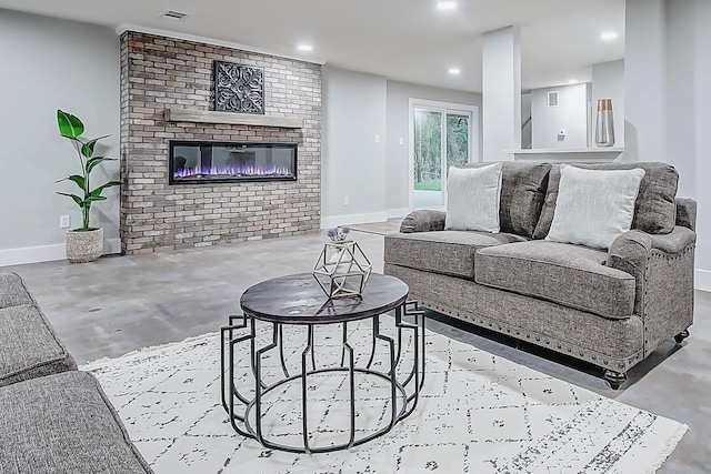 living room with a brick fireplace