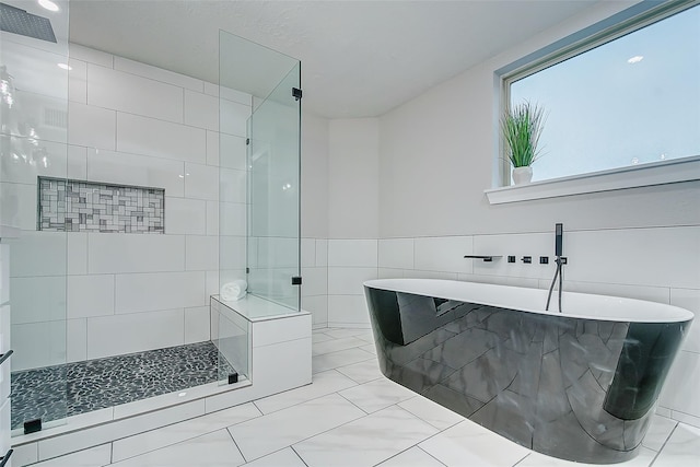 bathroom featuring plus walk in shower