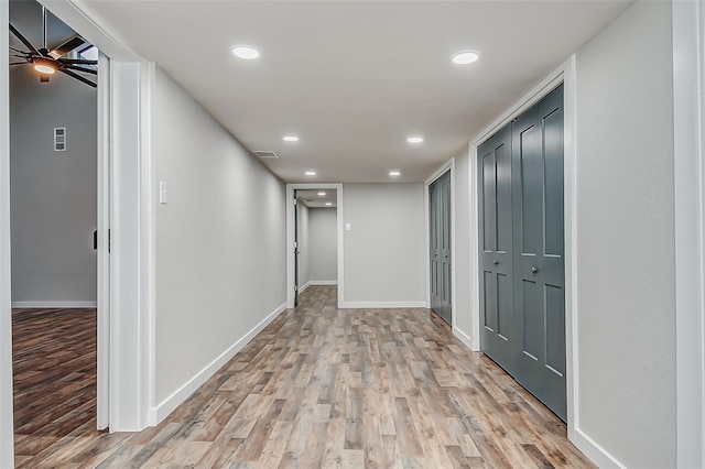 corridor featuring light hardwood / wood-style flooring