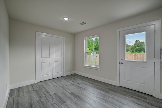 interior space featuring plenty of natural light and light hardwood / wood-style flooring