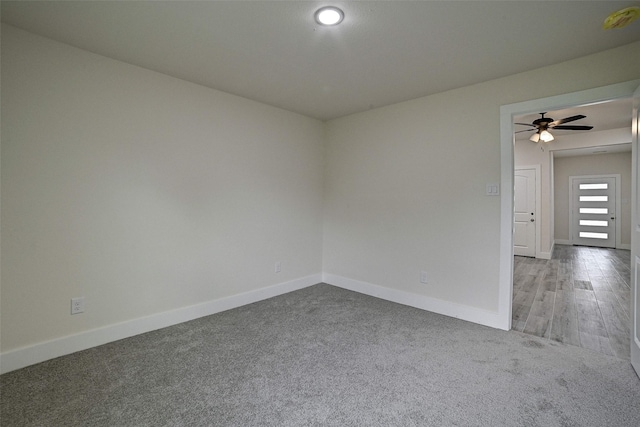 empty room with carpet floors and ceiling fan