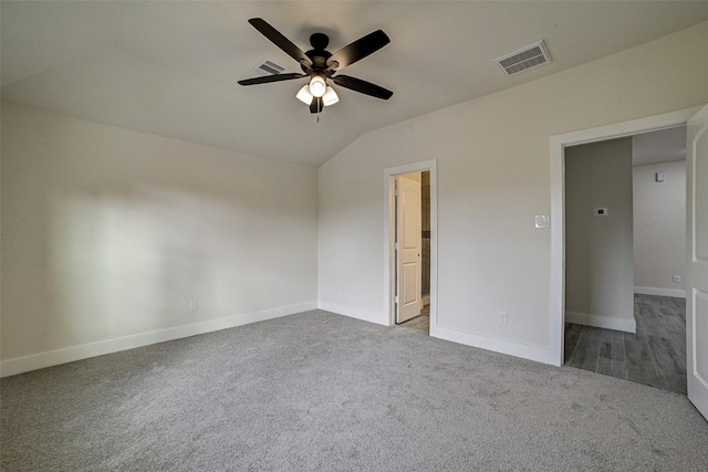 unfurnished bedroom featuring carpet floors, ceiling fan, and lofted ceiling