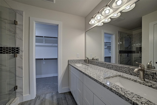 bathroom featuring vanity and walk in shower